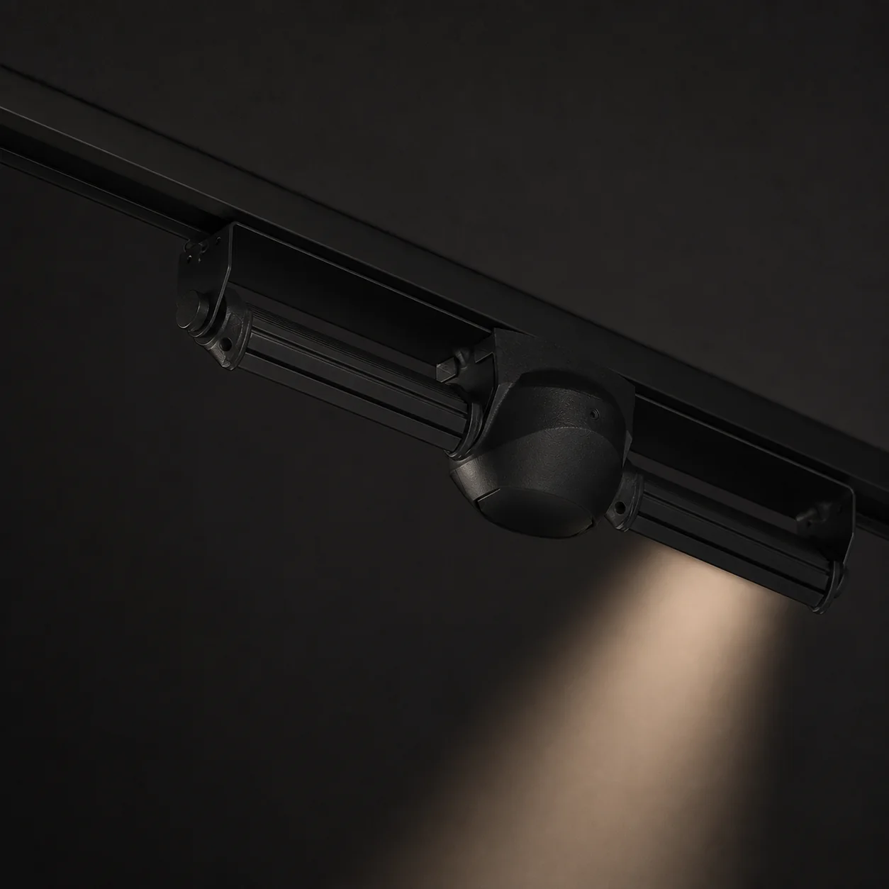 A slim linear luminaire nearly disappearing into a dark ceiling plane